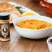 Butterscotch Rub on a table with sweet potato mashed potatoes and ham