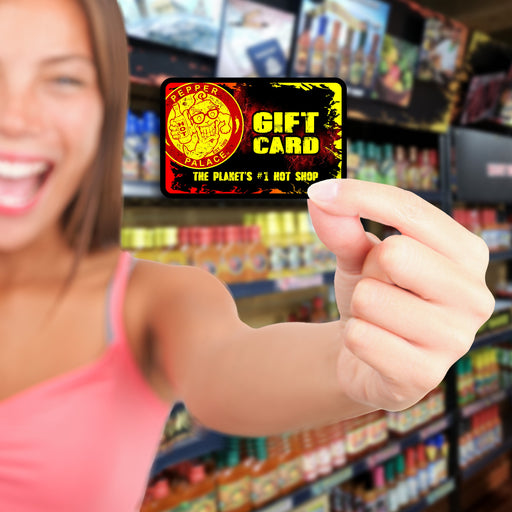 Person holding a Pepper Palace Gift Card in a store